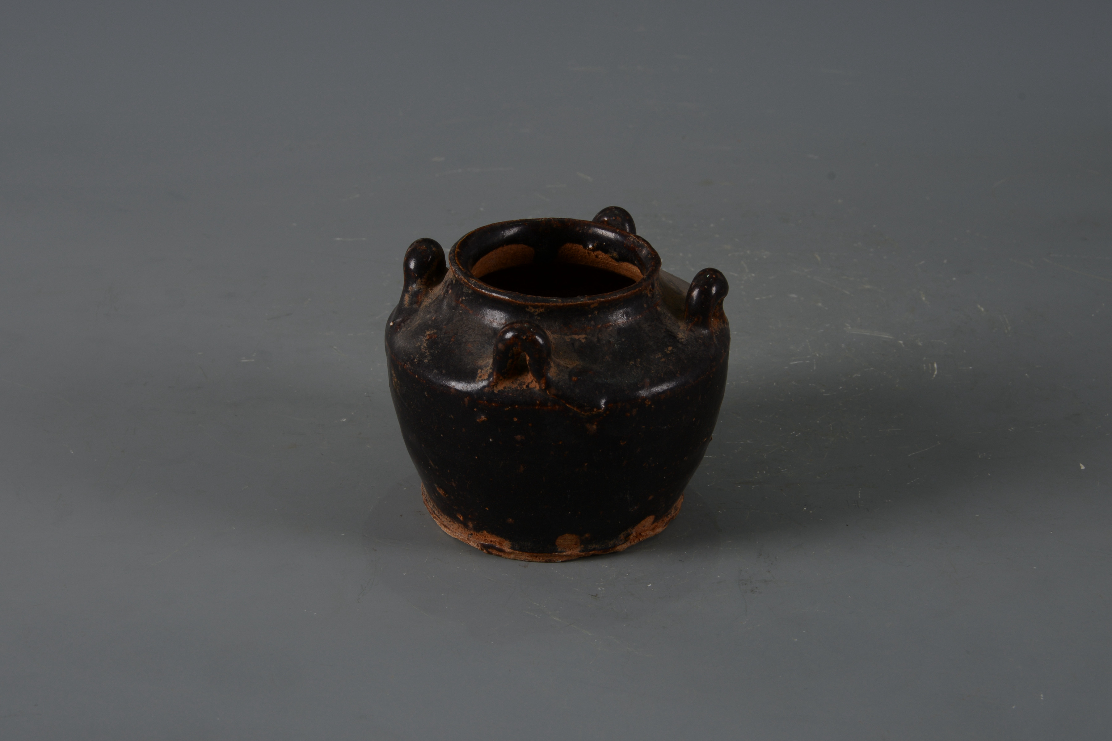 明黑釉四系陶罐