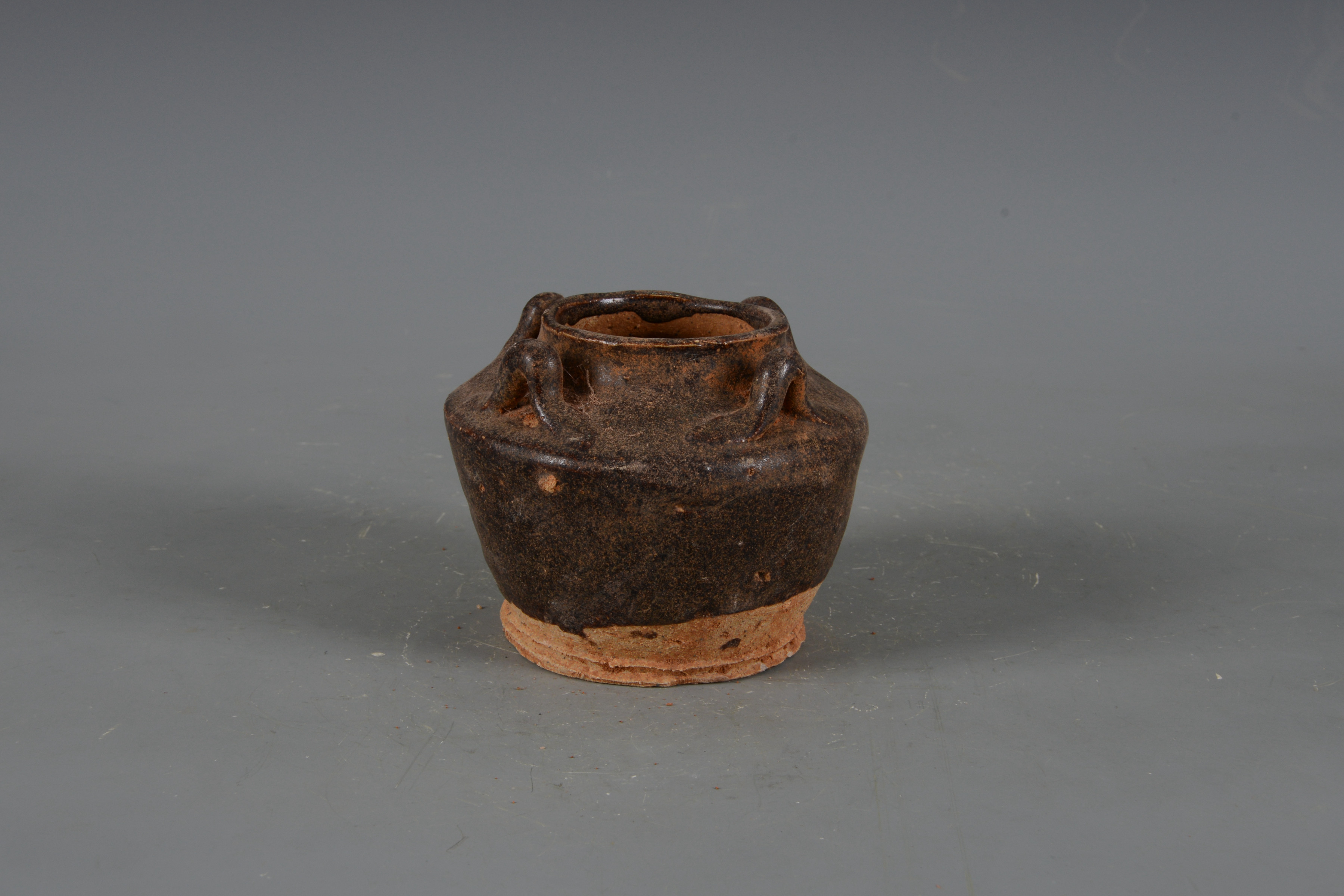 明褐釉四系陶罐